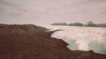 A majestic glacier surrounded by towering mountains video