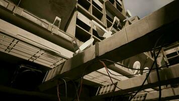 A building with a complex network of wires attached to its concrete roof video