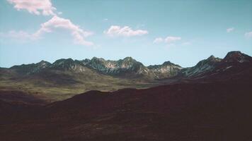 A scenic mountain range with billowing clouds in the sky video