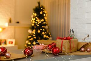 Christmas gift box. Christmas presents in boxes at white wooden table. photo