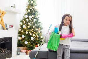 Little housekeeping fairy girl doing home chores photo