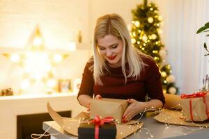 Portrait of a young woman during preparations for Christmas at home photo