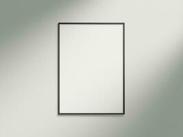 Minimal picture poster frame mockup on white wallpaper with sunlight photo