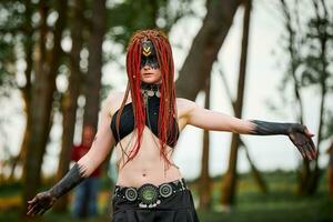 Mythological dancing girl faun on green lawn in public park outdoor art dancing event photo