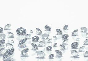 Beautiful Shiny Diamonds in Brilliant Cut on White Background - Crystal Background photo