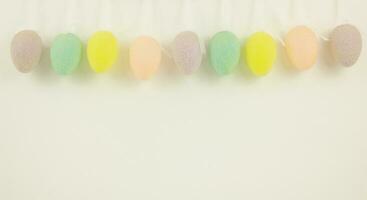 Garland of colorful decorative eggs. Copy space. Easter celebration. photo