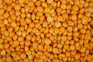 Red lentils close up. Background and texture photo