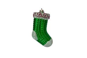 Green vintage Christmas tree decoration in the form of a Christmas sock isolated on a white background. photo