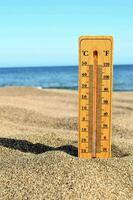 a thermometer on the beach photo