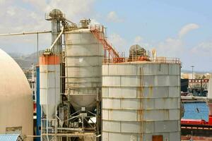 a large industrial plant with a large tank photo