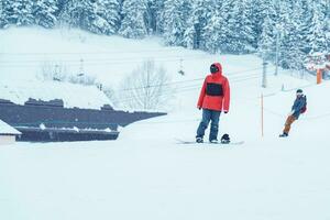 People playing Ski and Snowboard in winter season. Snow winter activity concept photo