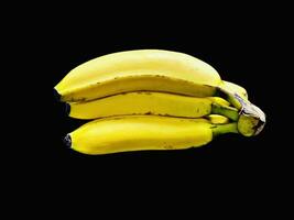Banana bunch isolated on black background. Photos in HD quality