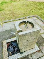 Drinking water and washing hand taps in park, public area photo