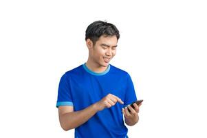 Happy man cheering excitedly in celebration after good news. Excited guy winner holding cellphone winning game online or investing trading, using mobile app celebrates victory success photo