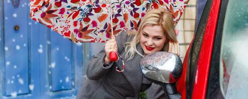 The woman under an umbrella, the first snow, christmas photo