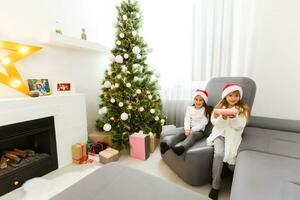 Christmas Happy funny children twins sisters at home photo