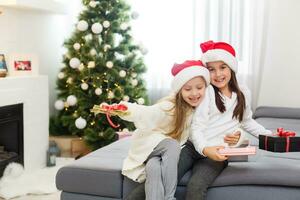 Christmas Happy funny children twins sisters at home photo