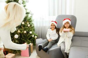 Christmas Happy funny children twins sisters at home photo