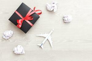 Airplane model flying among paper clouds, Traveling concept photo