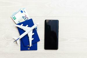 Mockup image of mobile smartphone , airplane and check book isolated on white background. Business technology trip and travel,paycheck concept. photo