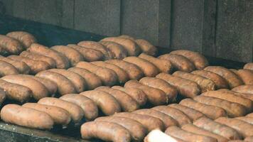 Hot dog, sausage or frankfurter cooking at grill video