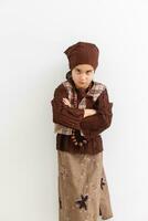 Portrait of little funny girl dressed like an old witch posing with broom in front of White background photo