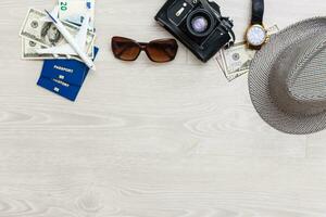 Travel and vacation concept. Trip accessories and items. Airplane toy over passport with airplane tickets. Top view flat lay with copy space photo
