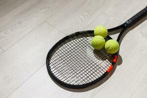 Tennis concept with the balls and racket photo