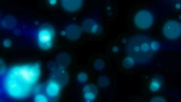 astratto blu sfocato vacanza sfondo con magico bokeh di raggiante luminosa leggero energia piccolo particelle di volante puntini su un' nero sfondo video