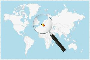 Magnifying glass showing a map of Belgium on a world map. vector