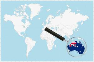 Magnifying glass showing a map of Australia on a world map. vector