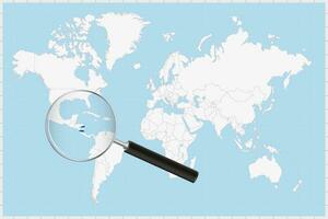 Magnifying glass showing a map of Nicaragua on a world map. vector