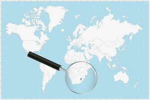 Magnifying glass showing a map of Lesotho on a world map. vector