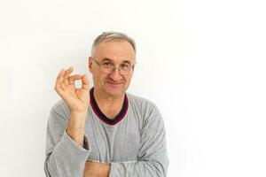 Smiling happy elderly man. Isolated over white background photo