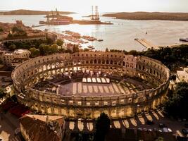 Aerial view of Pula Arena in the light of sunset photo