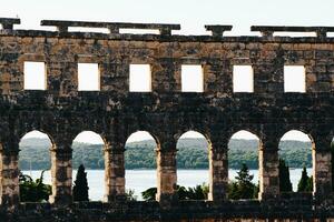 Sea view from the ancient Arena Pula during sunset photo