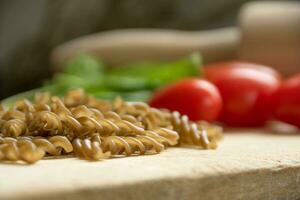 Uncooked gluten free Teff fusili pasta photo