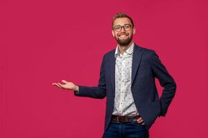 Studio shot of attractive brunette business man with glasses, in casual shirt, stylish black jacket, smiling. photo