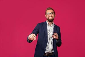 Studio shot of attractive brunette business man with glasses, in casual shirt, stylish black jacket, smiling. photo