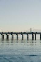 Spectacular sunset on the ocean pier photo