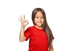 Girl showing positive sign on natural background photo