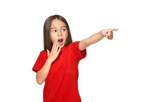 Cute girl in red t-shirt shows on white background photo