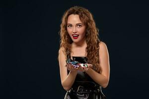 Casino concept. Portrait of young pretty caucasian woman, playing in casino. Roulette, poker chips, cards, wheel, isolated white background photo