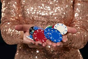 Casino concept. Portrait of young pretty caucasian woman, playing in casino. Roulette, poker chips, cards, wheel, isolated white background photo