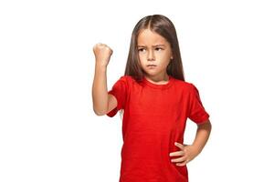 Beautiful girl in red t-shirt shakes her fist photo