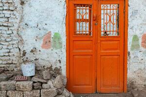 Colourful exterior wall of a Nubian house in Egypt. Typical African village houses facade. Medieval street. photo