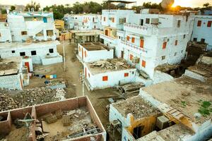 Colourful exterior wall of a Nubian house in Egypt. Typical African village houses facade. Medieval street. photo