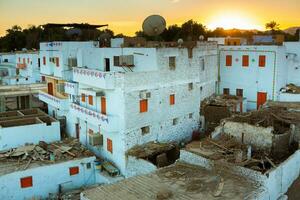 Colourful exterior wall of a Nubian house in Egypt. Typical African village houses facade. Medieval street. photo