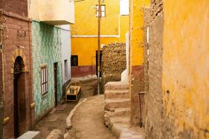 Colourful exterior wall of a Nubian house in Egypt. Typical African village houses facade. Medieval street. photo