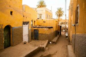 Colourful exterior wall of a Nubian house in Egypt. Typical African village houses facade. Medieval street. photo